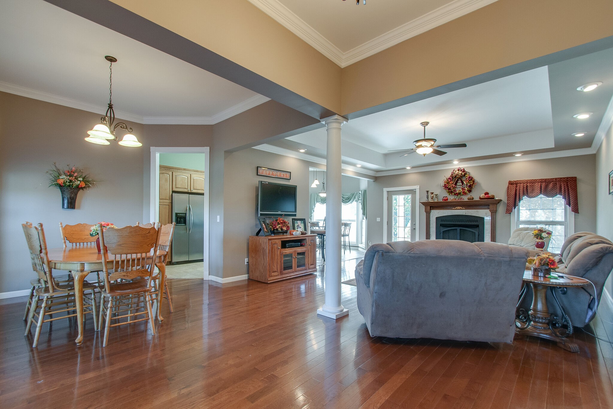 1230 Grindstone Hollow Road Dickson, TN 37055 - Photo 4 of 50 a living room with furniture a fireplace and a chandelier