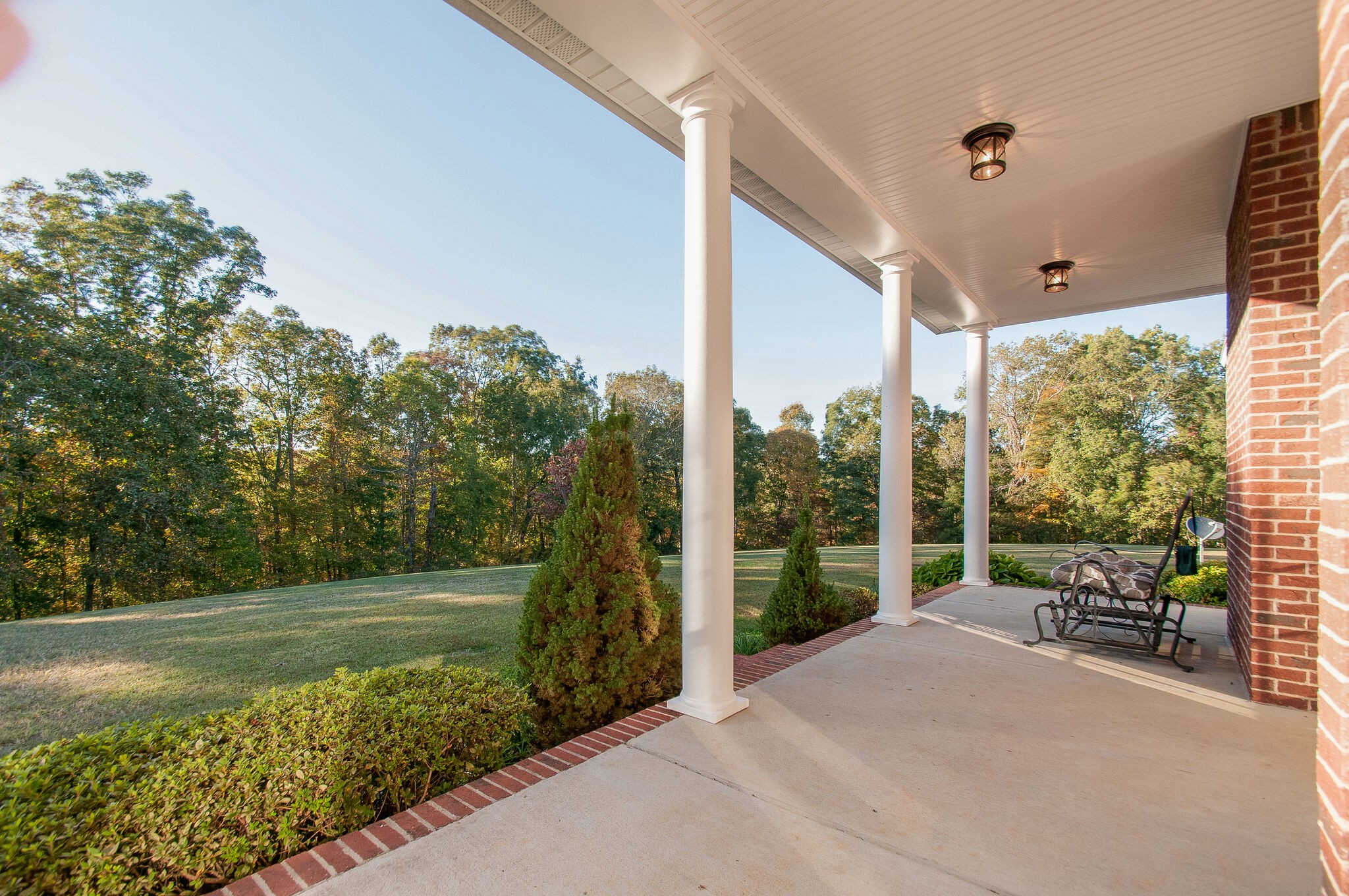 1230 Grindstone Hollow Road Dickson, TN 37055 - Photo 31 of 50 a balcony with table and chairs and potted plants