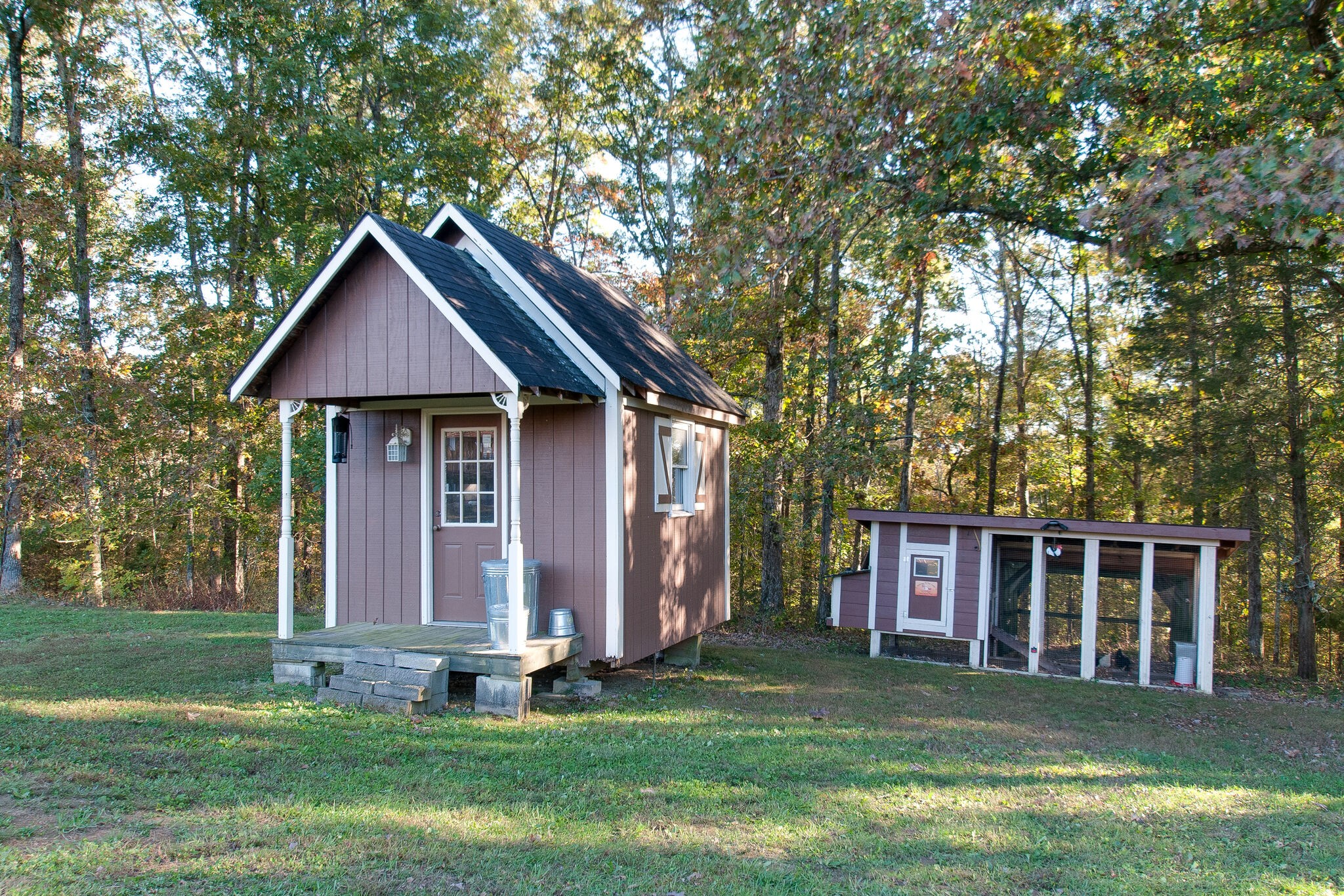 1230 Grindstone Hollow Road Dickson, TN 37055 - Photo 38 of 50 a front view of a house with a garden and trees