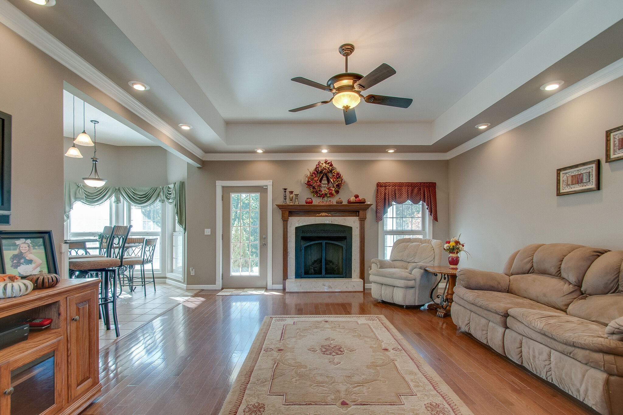 1230 Grindstone Hollow Road Dickson, TN 37055 - Photo 8 of 50 a living room with furniture a fireplace and a chandelier