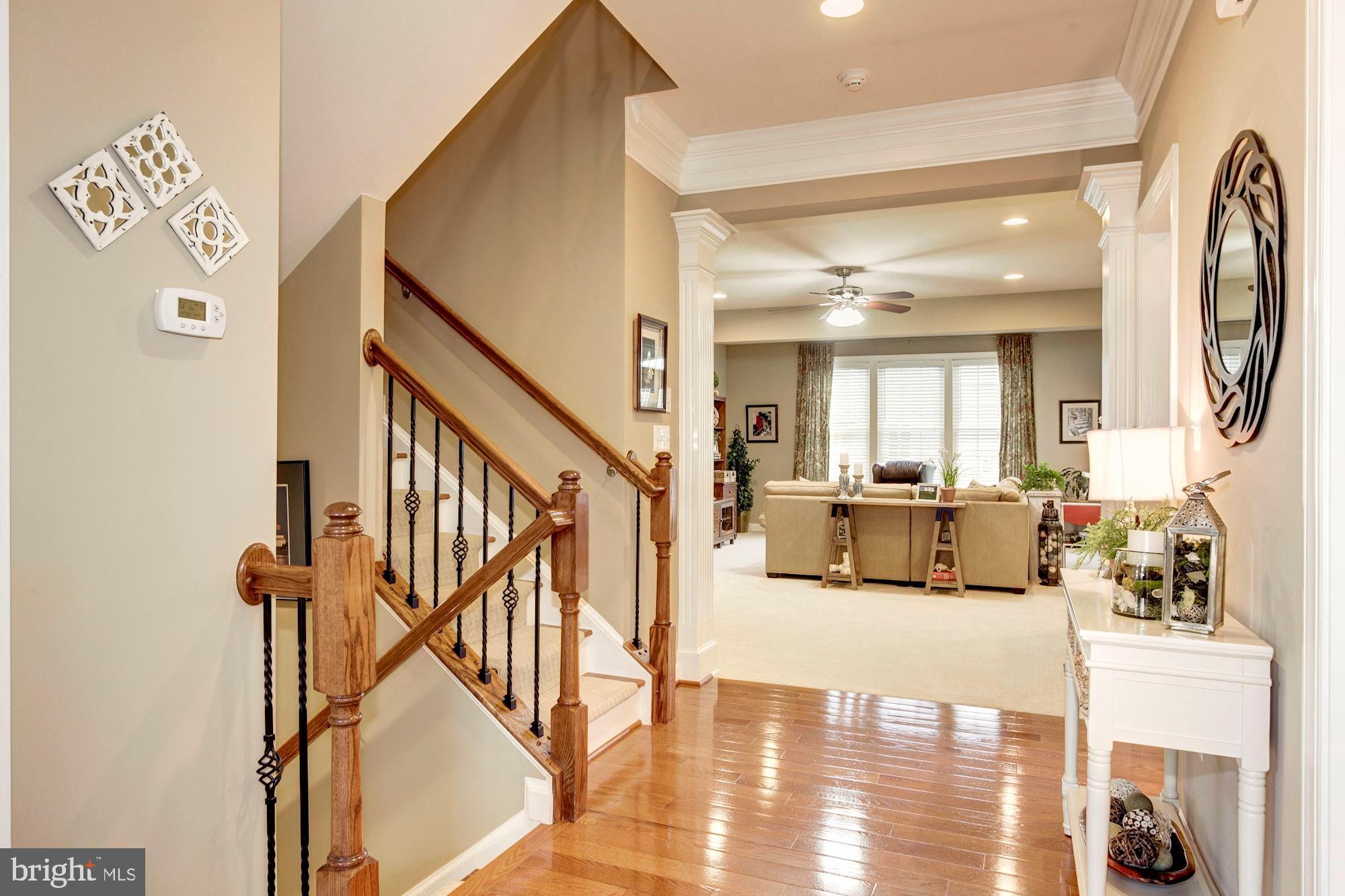 24960 Castleton Drive Chantilly, VA 20152 - Photo 22 of 44 a view of a hallway with furniture and floor to ceiling window