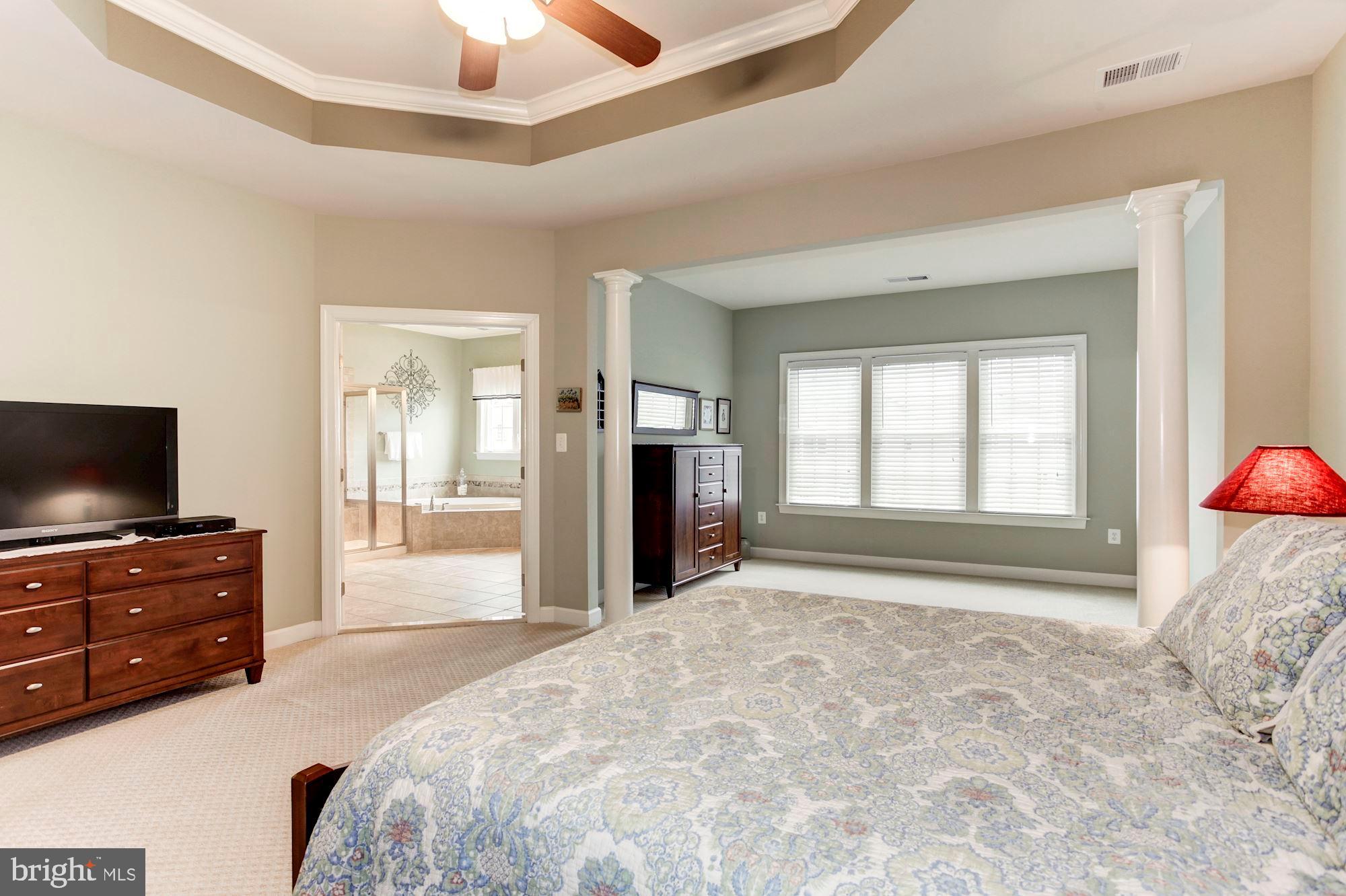 24960 Castleton Drive Chantilly, VA 20152 - Photo 24 of 44 a bedroom with a bed and a flat screen tv