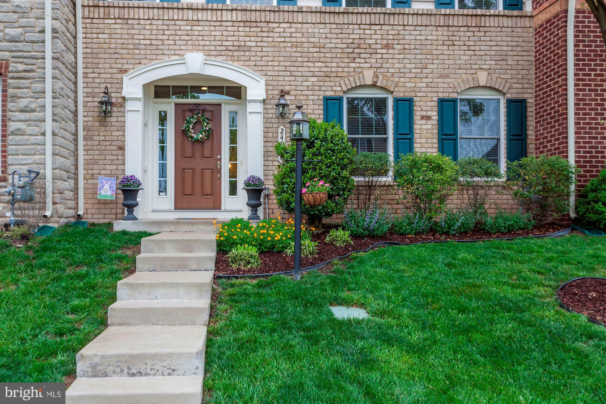 24960 Castleton Drive Chantilly, VA 20152 - Photo 41 of 44 a front view of a house with a garden