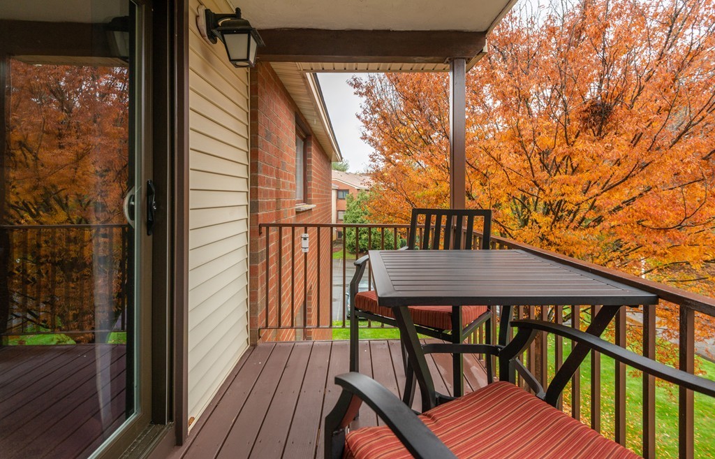 189 Littleton Road, Unit 19 Chelmsford, MA 01824 - Photo 18 of 42 a view of balcony with wooden floor and outdoor seating