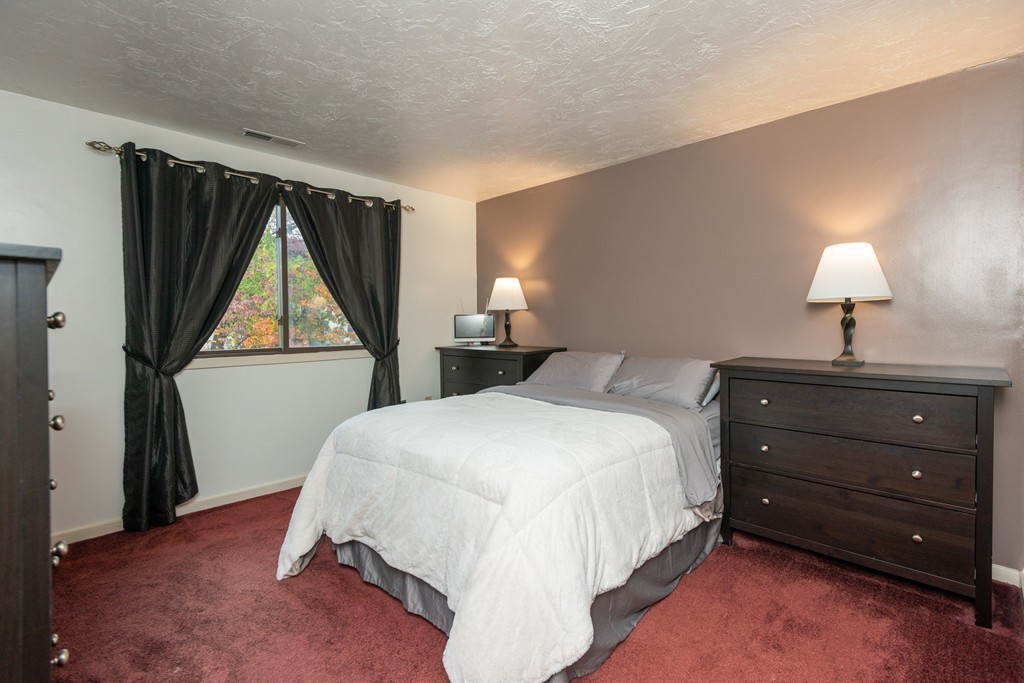 189 Littleton Road, Unit 19 Chelmsford, MA 01824 - Photo 33 of 42 a bed room with a bed and a window