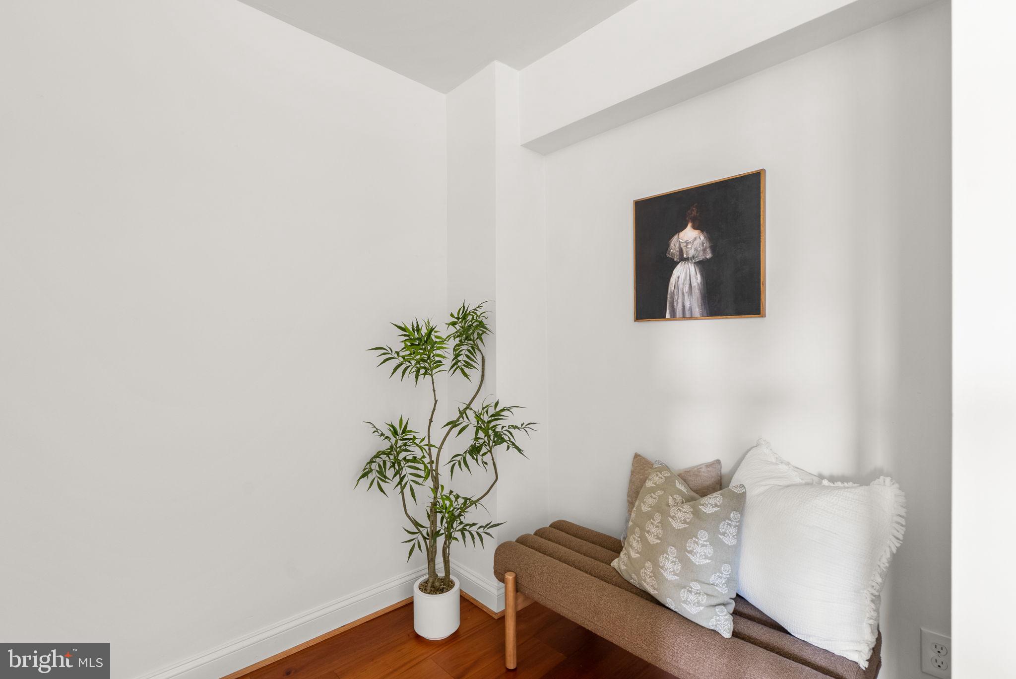 2500 Q Street Northwest, Unit 524 Washington, DC 20007 - Photo 20 of 50 a room with a table and a potted plant