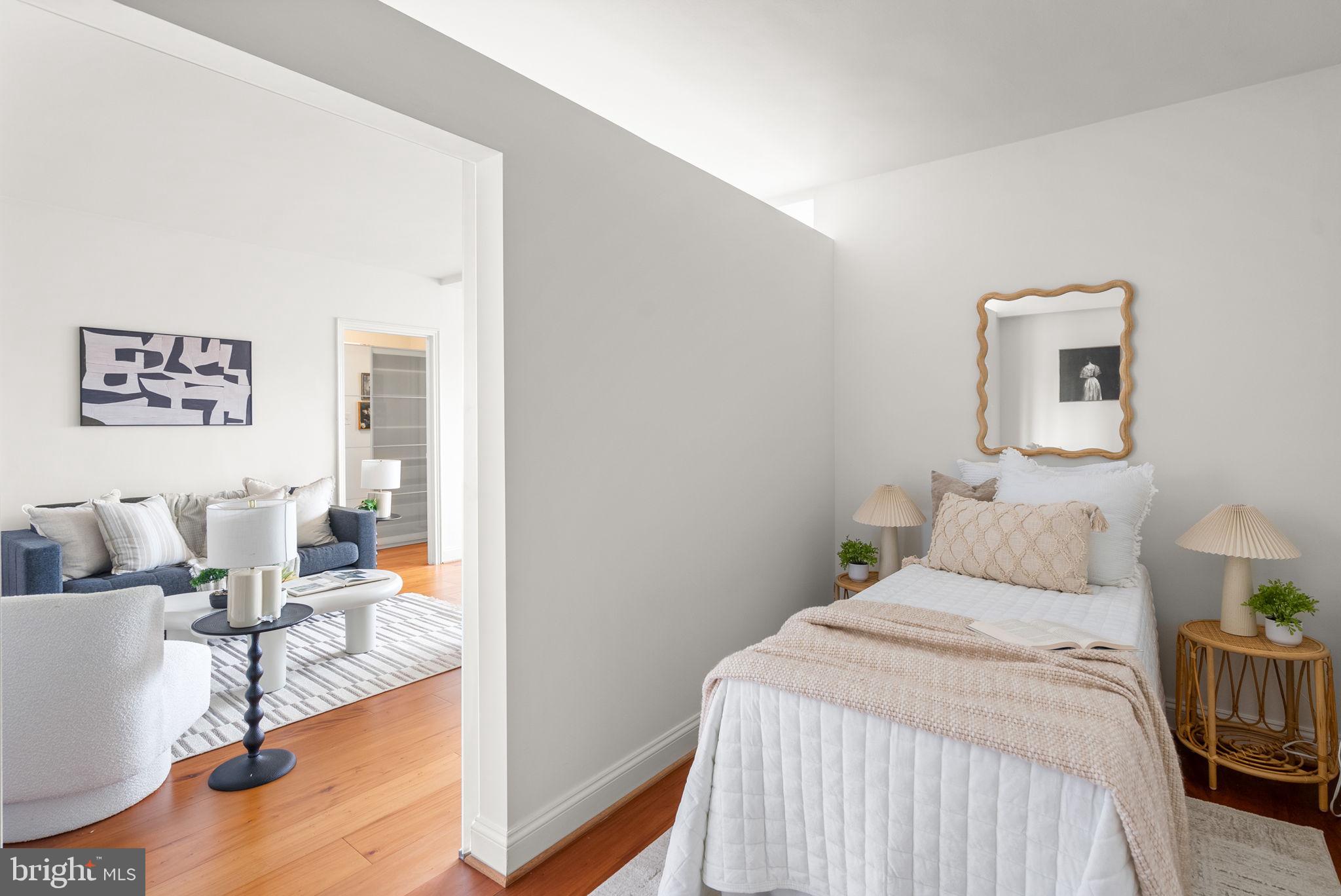 2500 Q Street Northwest, Unit 524 Washington, DC 20007 - Photo 21 of 50 a bedroom with a bed and a couch