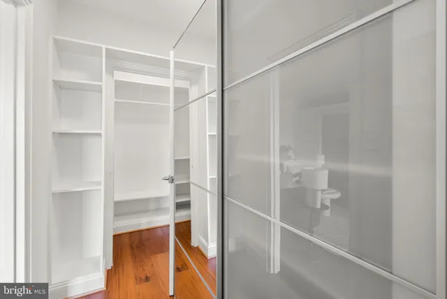 a bathroom with a glass shower door