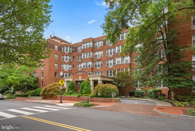 a view of a building with a yard