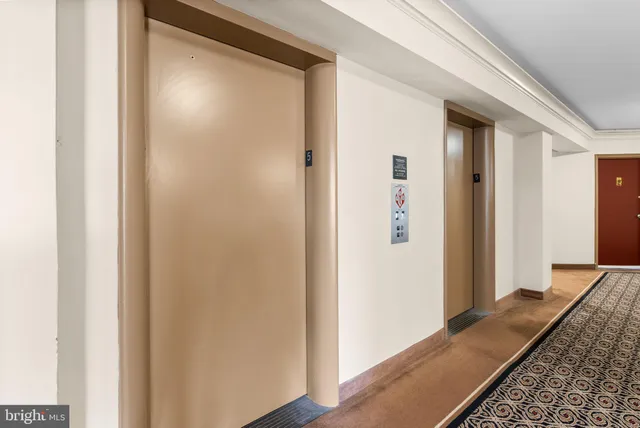 a view of hallway with wooden floor