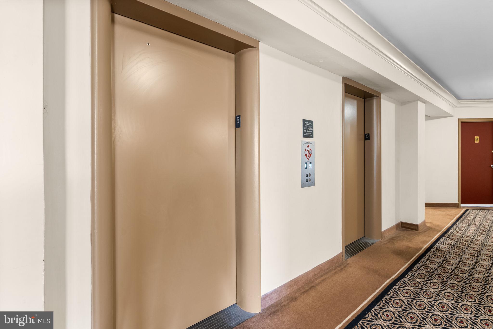 2500 Q Street Northwest, Unit 524 Washington, DC 20007 - Photo 33 of 50 a view of hallway with wooden floor
