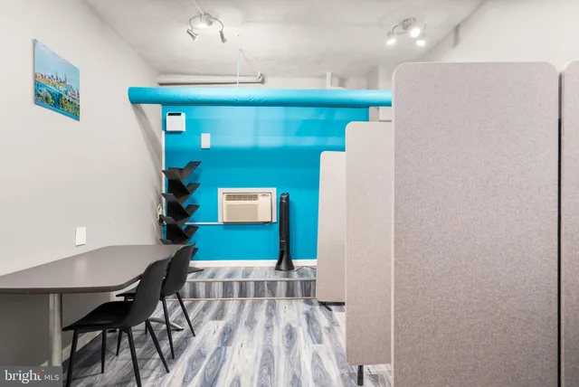 a kitchen with a table and chairs