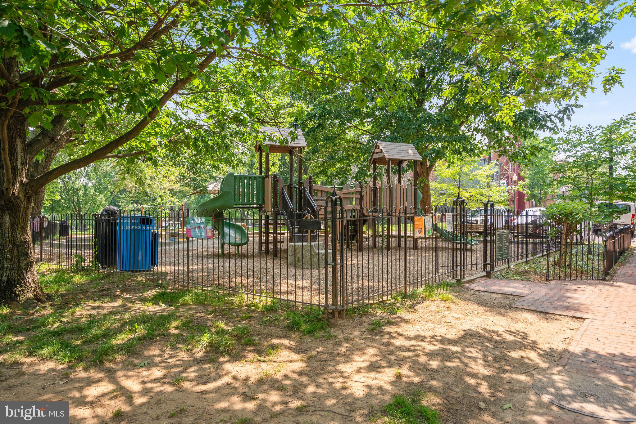 2500 Q Street Northwest, Unit 524 Washington, DC 20007 - Photo 48 of 50 a view of a backyard with wooden fence and large trees