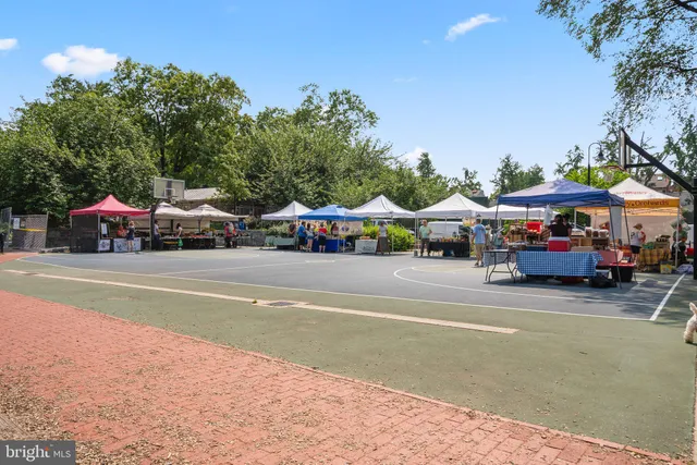 a view of street with parked cars