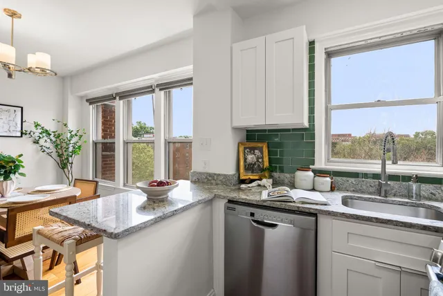 a kitchen with granite countertop a sink and a window