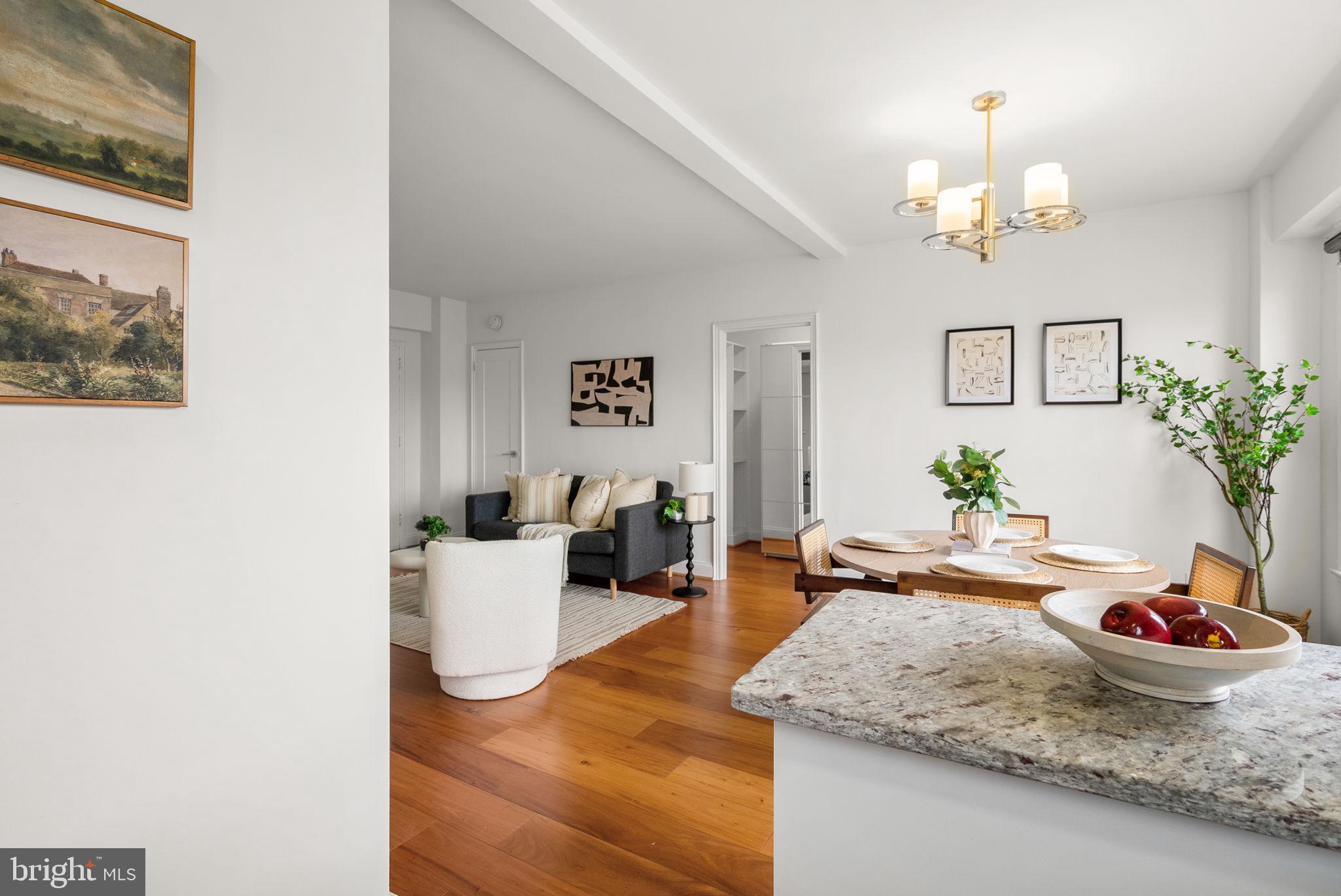 2500 Q Street Northwest, Unit 524 Washington, DC 20007 - Photo 10 of 50 a view of a dining room with a table and chairs