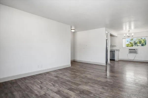 a view of an empty room with a window