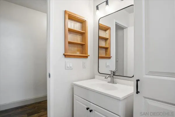 a bathroom with a sink and a mirror