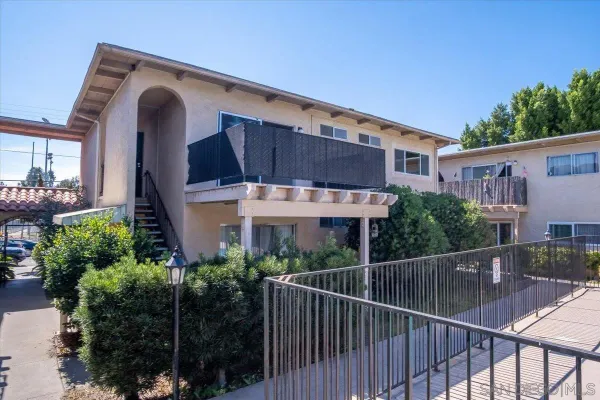 a view of a chair and table in the balcony