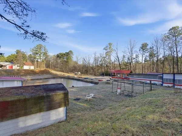 a view of backyard with trampoline