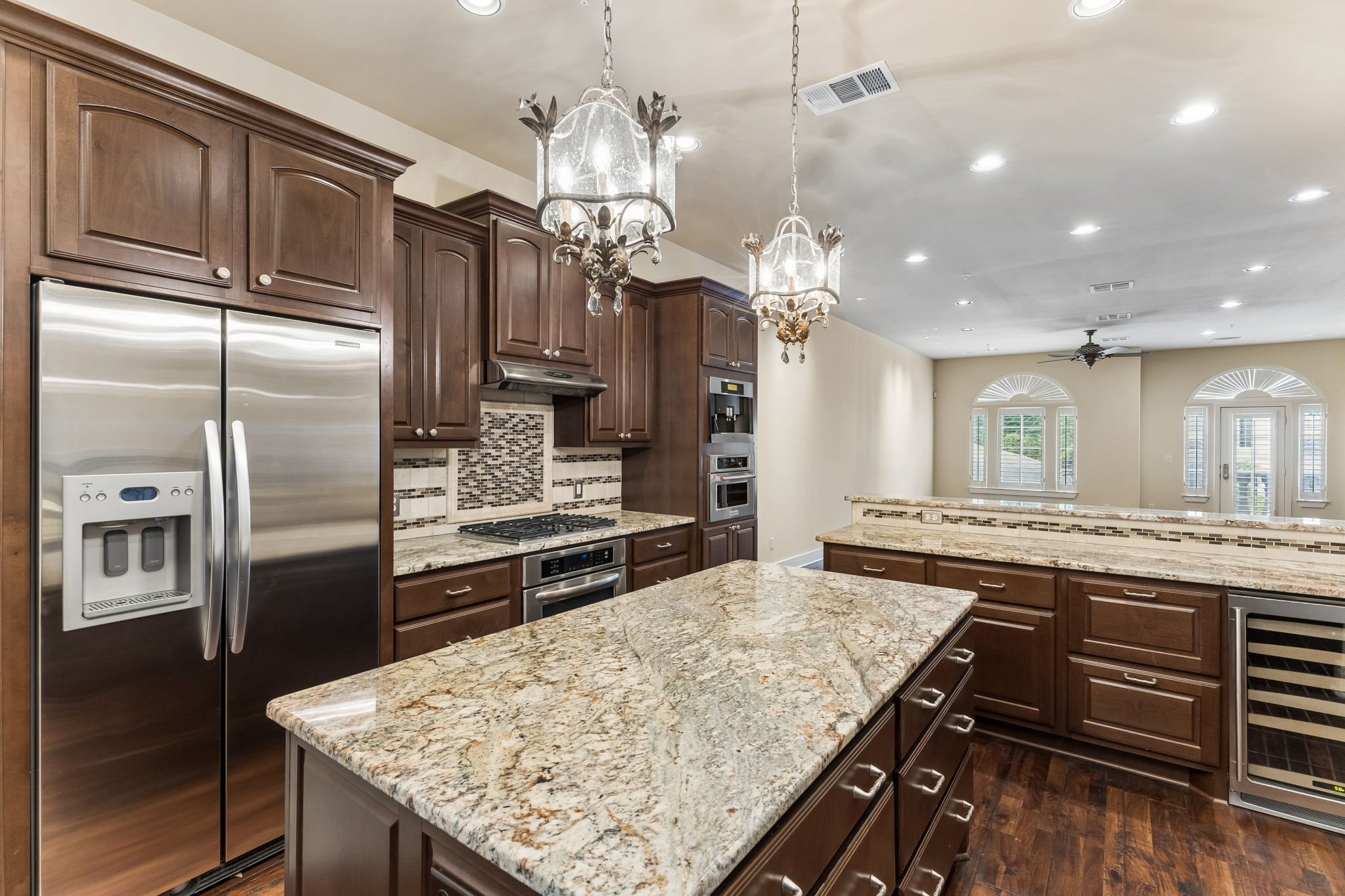 1529 Barton Springs Road, Unit 9 Austin, TX 78704 - Photo 16 of 37 Built in fridge, espresso maker, wine fridge, and large center island