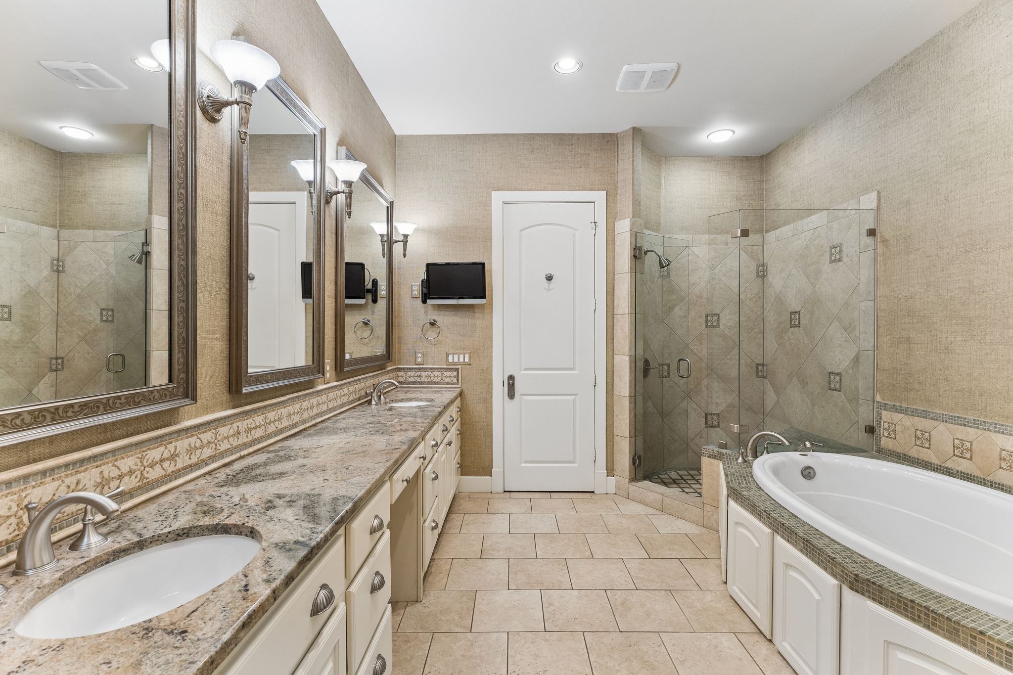 1529 Barton Springs Road, Unit 9 Austin, TX 78704 - Photo 30 of 37 Bathroom featuring a double vanity with granite countertops, an undermount sink, a freestanding tub, and a separate glass-enclosed shower