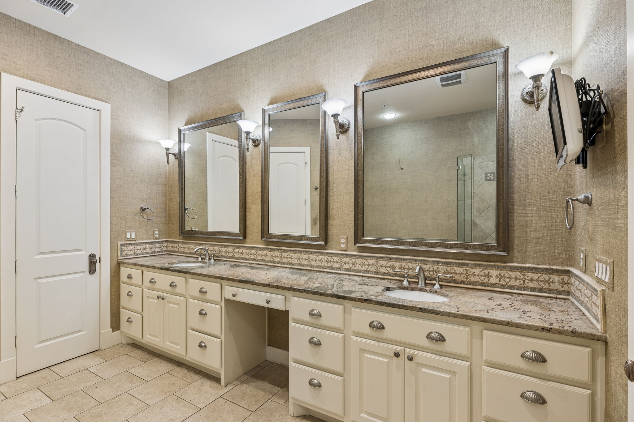 1529 Barton Springs Road, Unit 9 Austin, TX 78704 - Photo 32 of 37 The bathroom features a double vanity with two sinks, granite countertops, and decorative tile backsplash