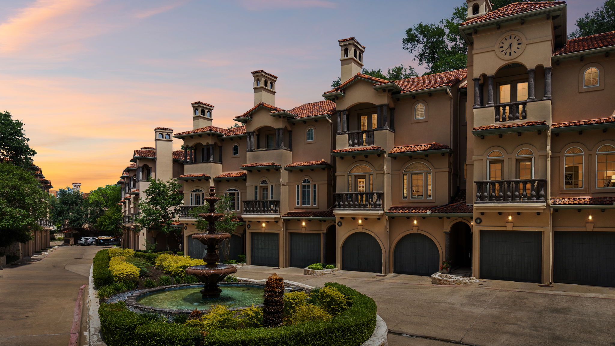 1529 Barton Springs Road, Unit 9 Austin, TX 78704 - Photo 37 of 37 The property features a Mediterranean-inspired architectural style with tiled roofs, stucco exteriors, and balconies with wrought iron railings