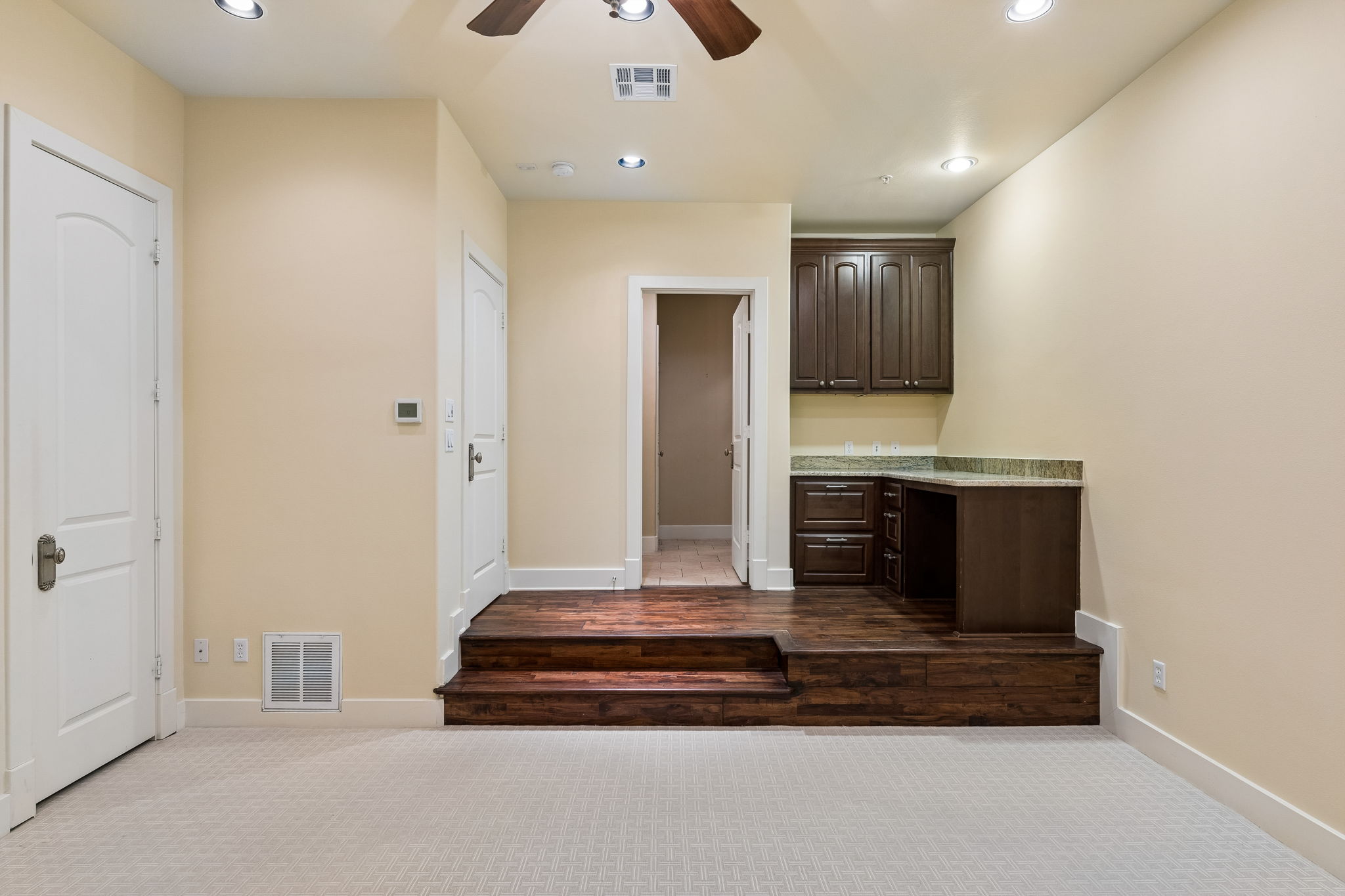 1529 Barton Springs Road, Unit 9 Austin, TX 78704 - Photo 4 of 37 Downstairs bedroom with built in desk and en suite bathroom