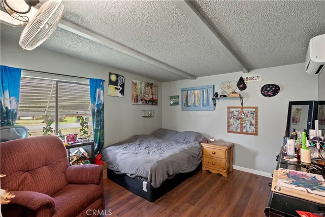 a bedroom with bed and a window