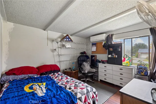 a bathroom with a granite countertop sink a toilet and shower curtain