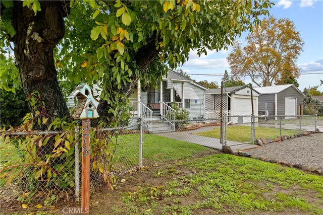 a front view of a house with a glass windows and door