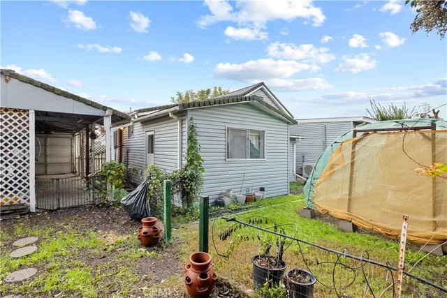 a blue house with a yard and garage