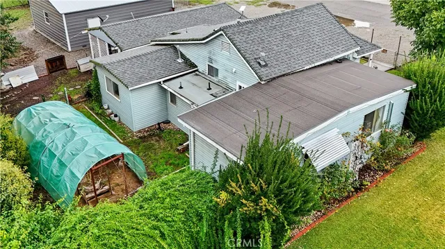 an aerial view of a house with a garden
