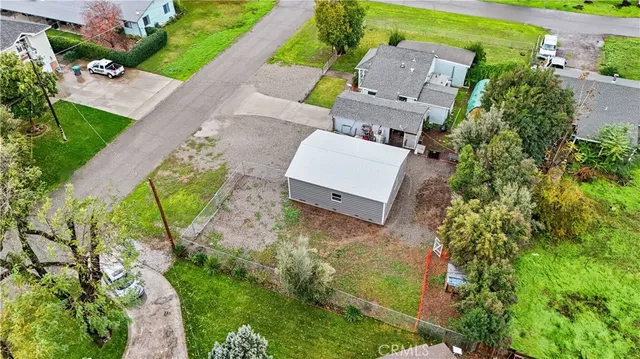 an aerial view of a house with a garden