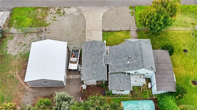 an aerial view of a house with a yard and garden
