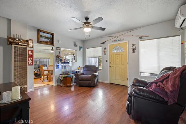 a dining room with furniture and a kitchen view