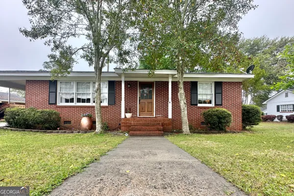 a front view of a house with garden and porch
