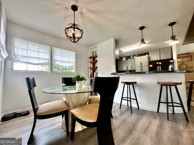 a dining room with furniture and window