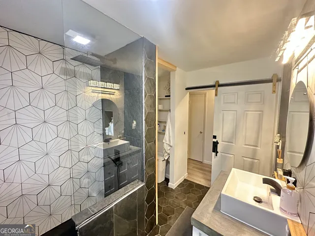a bathroom with a sink and a mirror