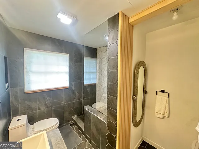 a bathroom with a sink and mirror