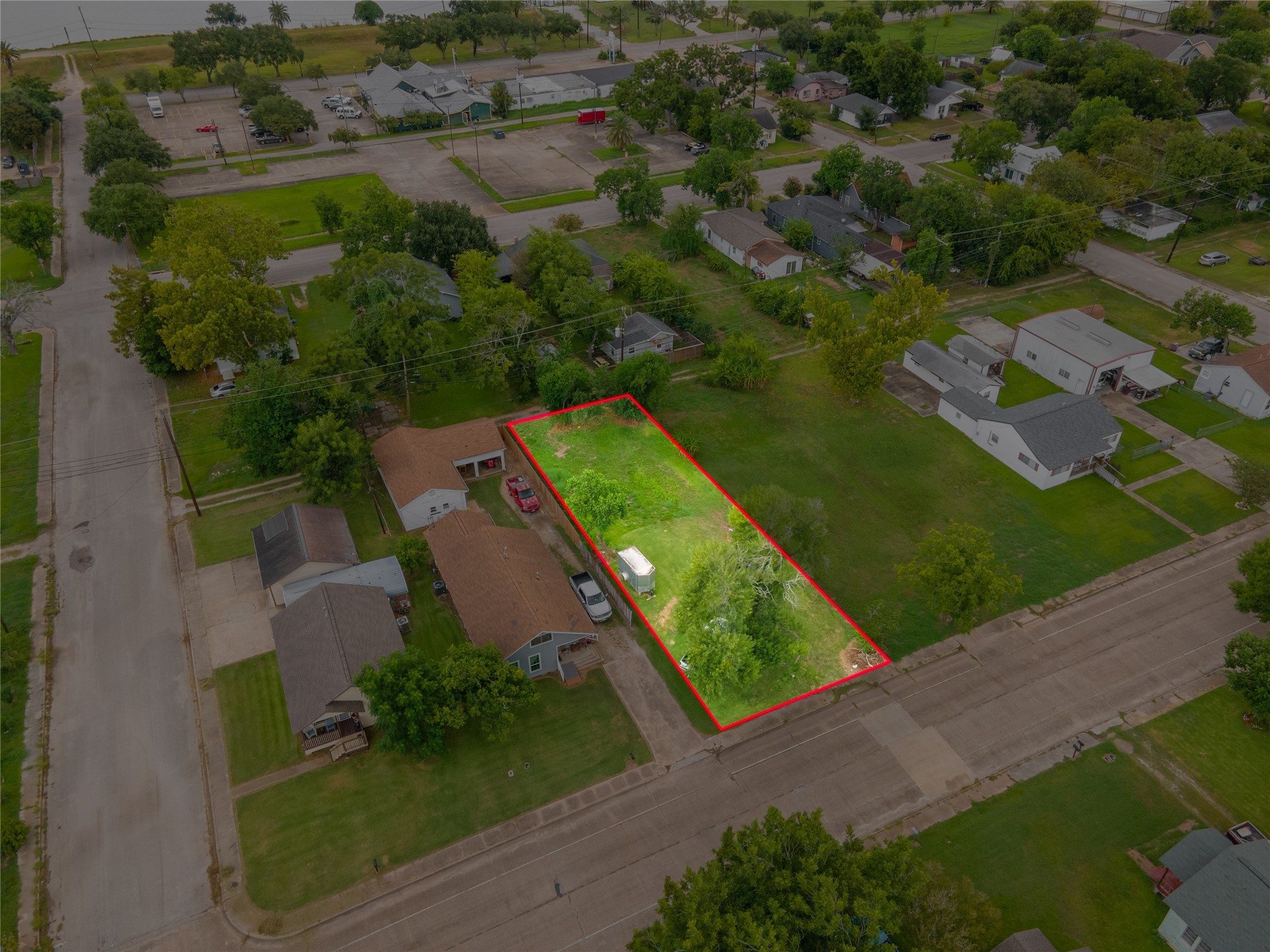 922 West 4th Street Freeport, TX 77541 - Photo 3 of 11 an aerial view of a house with a yard basket ball court and outdoor seating