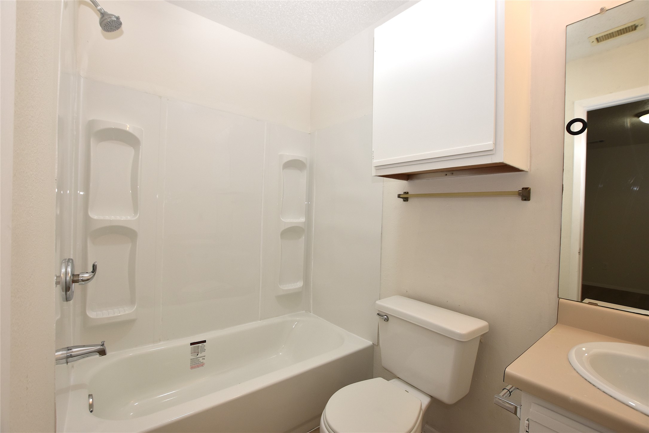 2801 West Slaughter Lane, Unit A Austin, TX 78748 - Photo 12 of 15 a bathroom with a toilet sink and shower