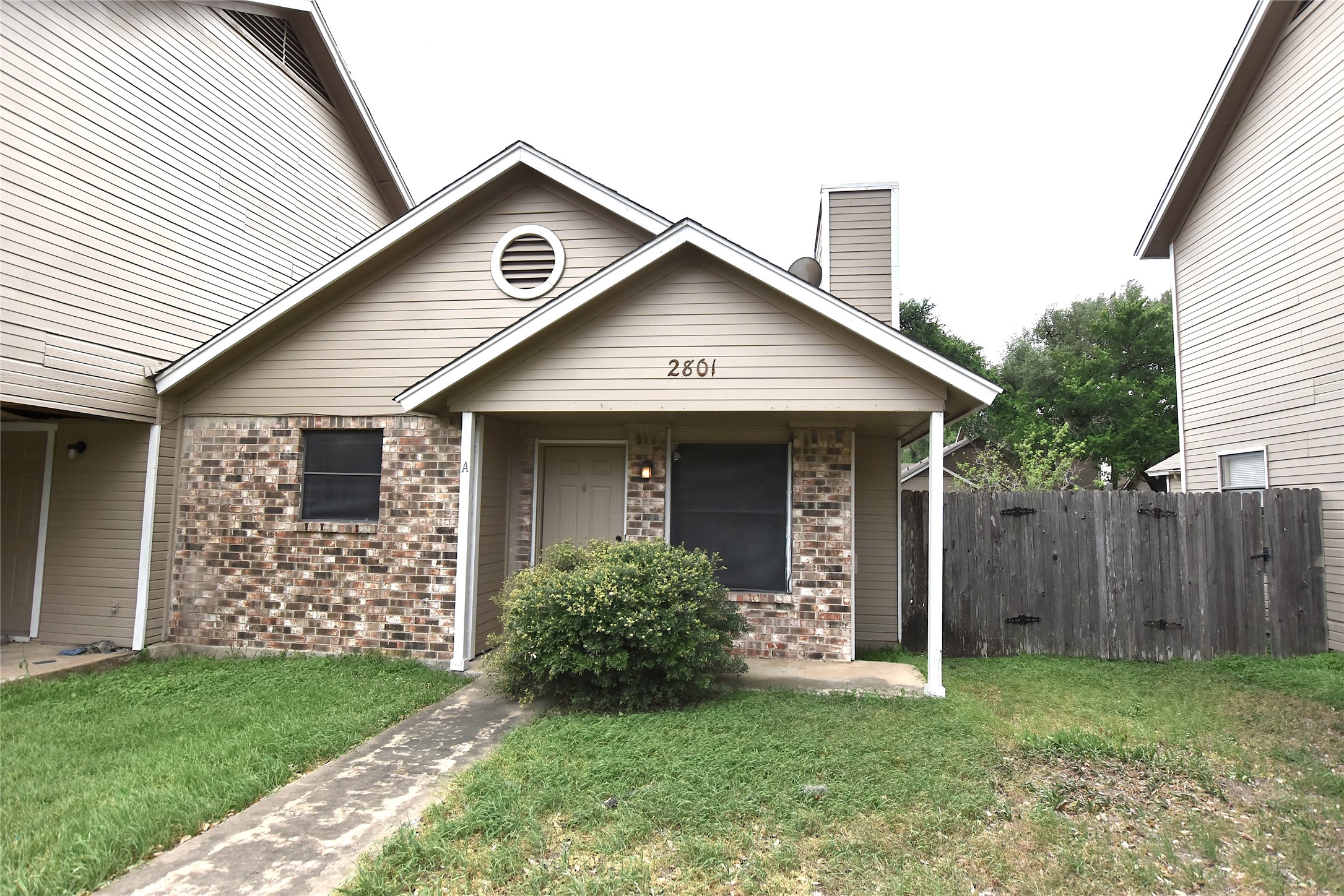 2801 West Slaughter Lane, Unit A Austin, TX 78748 - Photo 2 of 15 a front view of a house with a yard