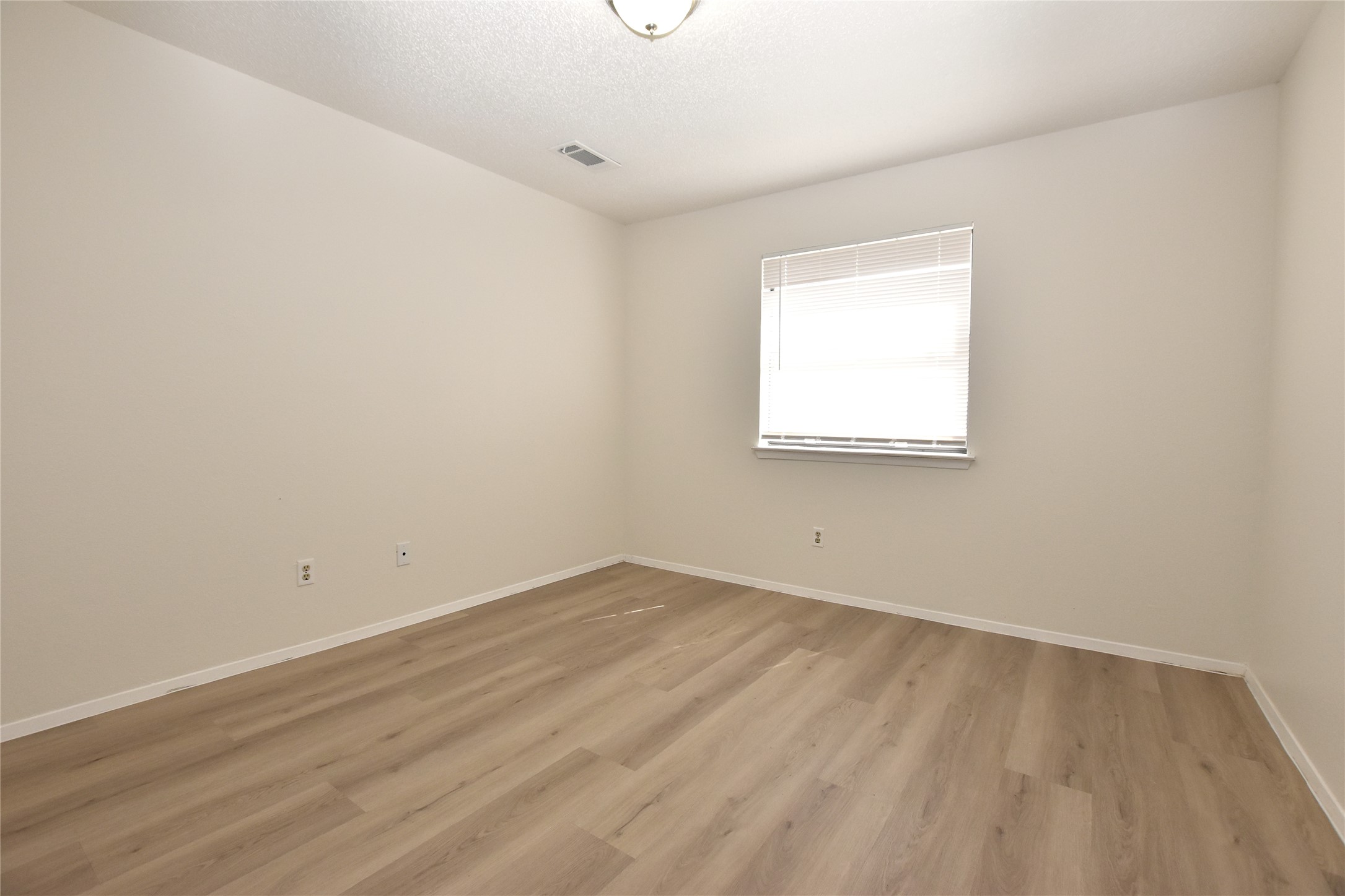2801 West Slaughter Lane, Unit A Austin, TX 78748 - Photo 5 of 15 an empty room with a window