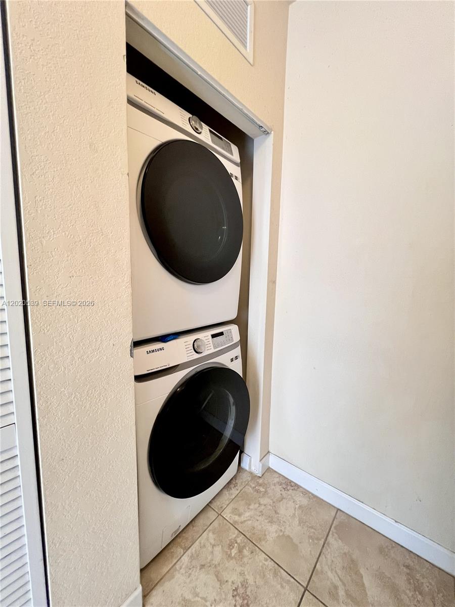 17001 Southwest 96th Street Miami, FL 33196 - Photo 21 of 23 a close up view of a washer and dryer