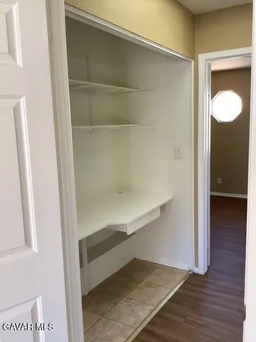 a view of an empty walk in closet