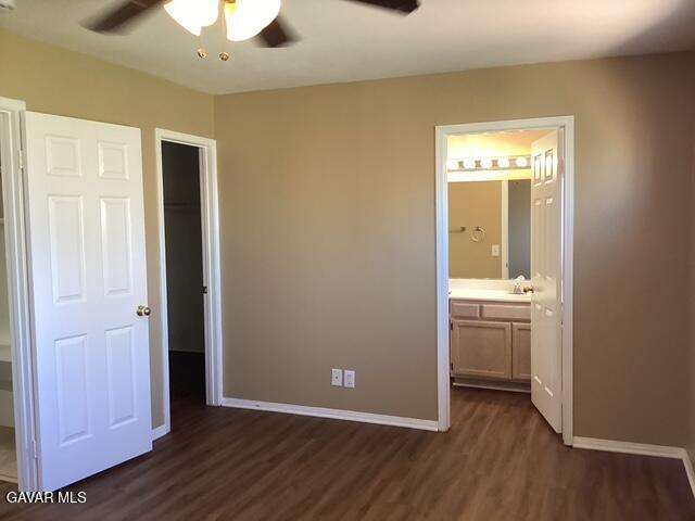 43469 30th Street West, Unit 3 Lancaster, CA 93536 - Photo 14 of 17 wooden floor in an empty room with a window