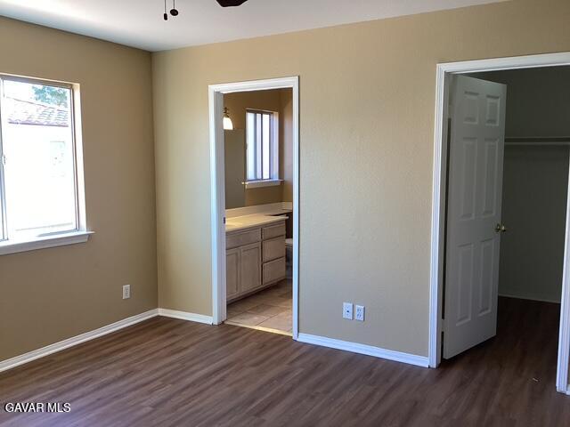 43469 30th Street West, Unit 3 Lancaster, CA 93536 - Photo 7 of 17 a view of a room with wooden floor and closet
