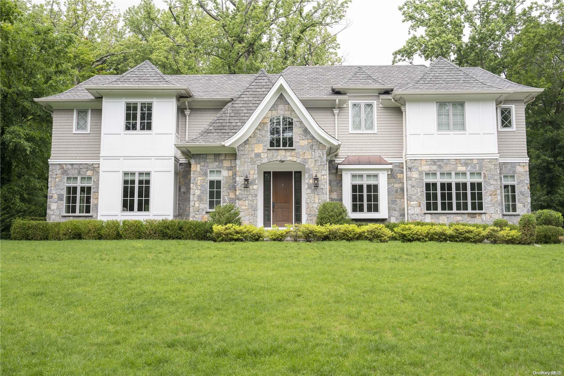 front view of a house and a yard